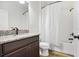 Bathroom featuring granite counters, wood-look tile flooring, and shower with tub at 11911 Greenchop Pl, Riverview, FL 33579