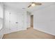 Bedroom features carpeted floors, a ceiling fan and walk-in closet at 11911 Greenchop Pl, Riverview, FL 33579
