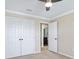 Bedroom features carpeted floors, a ceiling fan and an ensuite bathroom at 11911 Greenchop Pl, Riverview, FL 33579