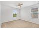 Bedroom features carpeted floors, a ceiling fan and two windows at 11911 Greenchop Pl, Riverview, FL 33579