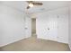 Bedroom features carpeted floors, a ceiling fan, and walk-in closet at 11911 Greenchop Pl, Riverview, FL 33579