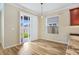 Light-filled dining area with sliding glass doors leading to the backyard at 11911 Greenchop Pl, Riverview, FL 33579