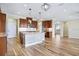 Spacious kitchen showcases an island with barstool seating, stainless steel appliances, and a view to the dining area at 11911 Greenchop Pl, Riverview, FL 33579