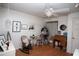 Neutral bedroom featuring a ceiling fan, whimsical decor, and light-colored walls at 11928 Mandarin Ct, Seminole, FL 33772