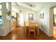 Open dining area with hardwood floors offering easy access to the kitchen, providing a convenient layout at 11928 Mandarin Ct, Seminole, FL 33772