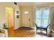 Inviting foyer with wood-look flooring, bench seating, stylish accents, and lots of natural light at 11928 Mandarin Ct, Seminole, FL 33772