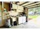 Functional garage equipped with laundry facilities and extra storage space at 11928 Mandarin Ct, Seminole, FL 33772