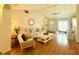 Bright and comfortable living room featuring vaulted ceiling, natural light, and modern décor with cozy seating at 11928 Mandarin Ct, Seminole, FL 33772