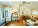 Spacious living room featuring bar seating, dining area, and a comfortable seating area with hardwood floors at 11928 Mandarin Ct, Seminole, FL 33772