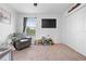 Bedroom featuring a window, closet, chair, and a TV, offering a cozy space at 12107 Nouveau Ave, Spring Hill, FL 34610