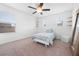 Bright bedroom with a ceiling fan and three windows with a single bed at 12107 Nouveau Ave, Spring Hill, FL 34610