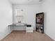 Bright bedroom featuring neutral carpet, a ceiling fan, a desk and shelving unit at 12107 Nouveau Ave, Spring Hill, FL 34610