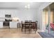 Dining room adjacent to kitchen with sliding doors to outdoor patio at 12107 Nouveau Ave, Spring Hill, FL 34610
