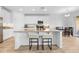 Bright kitchen featuring a large island with seating and stainless steel appliances at 12107 Nouveau Ave, Spring Hill, FL 34610