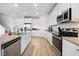Modern kitchen with stainless steel appliances and white cabinets at 12107 Nouveau Ave, Spring Hill, FL 34610