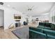 Bright and airy living room offers a spacious feel, connecting seamlessly to the kitchen and dining area at 12107 Nouveau Ave, Spring Hill, FL 34610