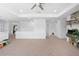 Large loft area with neutral carpet, and access to multiple rooms, offering flexibility at 12107 Nouveau Ave, Spring Hill, FL 34610