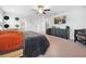 This bright main bedroom has carpet, a cozy bed, decor, a television, and a crib at 12107 Nouveau Ave, Spring Hill, FL 34610