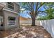 The home's backyard has perimeter fencing and a mature shade tree at 12653 Longcrest Dr, Riverview, FL 33579