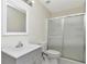 This bathroom offers a single sink vanity, a toilet, and a glass-enclosed shower at 12653 Longcrest Dr, Riverview, FL 33579