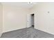 This bedroom features plush gray carpet and a doorway leading to the hall at 12653 Longcrest Dr, Riverview, FL 33579