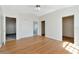 This spacious bedroom features wood floors and access to bathroom at 12653 Longcrest Dr, Riverview, FL 33579