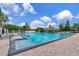 Large community pool with clear blue water and plenty of lounge chairs for relaxing at 12653 Longcrest Dr, Riverview, FL 33579