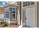 Close-up view of the home's entrance showing the front door and window detailing at 12653 Longcrest Dr, Riverview, FL 33579