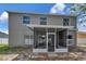 Rear exterior view of the home featuring a covered patio and a spacious backyard at 12653 Longcrest Dr, Riverview, FL 33579