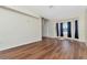 Spacious living room showcasing wood floors and a bay window with dark drapes at 12653 Longcrest Dr, Riverview, FL 33579