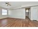 Spacious living room featuring hardwood floors and abundant natural light from the window at 12653 Longcrest Dr, Riverview, FL 33579