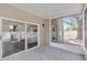 Covered patio with outdoor light fixture and sliding glass door, perfect for entertaining and relaxing outdoors at 12653 Longcrest Dr, Riverview, FL 33579