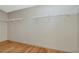 Walk-in closet with wood floor and shelving with storage at 12653 Longcrest Dr, Riverview, FL 33579