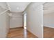 Spacious walk-in closet has shelving and wood floors at 12653 Longcrest Dr, Riverview, FL 33579