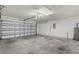 Spacious garage with an automatic door and plenty of room for parking at 13423 Lake Monroe Pl, Riverview, FL 33579