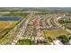 High aerial showing the neighborhood layout, including the ponds and other bodies of water at 14434 Scottburgh Glen Dr, Wimauma, FL 33598