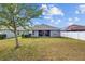 Spacious backyard with covered patio, grill and ample lawn at 14434 Scottburgh Glen Dr, Wimauma, FL 33598