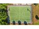 Aerial shot of basketball court surrounded by lush green trees, offering a great recreational opportunity at 14434 Scottburgh Glen Dr, Wimauma, FL 33598