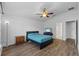 Spacious bedroom showcasing vaulted ceilings, laminate floors, and a ceiling fan at 14434 Scottburgh Glen Dr, Wimauma, FL 33598