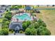 Aerial view of the community pool, with multiple lounge chairs and areas for recreation at 14434 Scottburgh Glen Dr, Wimauma, FL 33598