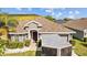 Charming home exterior with well-maintained landscaping and a covered front entry at 14434 Scottburgh Glen Dr, Wimauma, FL 33598