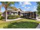 Charming home with well-manicured lawn, decorative shrubs, and modern exterior at 14434 Scottburgh Glen Dr, Wimauma, FL 33598