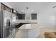 Kitchen with granite countertops, stainless steel appliances, and ample cabinet space for efficient storage at 14434 Scottburgh Glen Dr, Wimauma, FL 33598