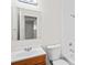 Functional bathroom features a single sink vanity, toilet, and shower-tub combo at 16139 Villa Dr, Hudson, FL 34667