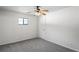 Neutral bedroom boasts neutral carpet, a single window, and a closet at 16139 Villa Dr, Hudson, FL 34667