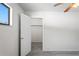 Bedroom boasts neutral carpet and a walk-in closet with wire shelving at 16139 Villa Dr, Hudson, FL 34667