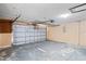 Spacious garage with a white door and functional garage door opener at 16139 Villa Dr, Hudson, FL 34667