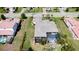 Aerial view of house with pool and patio, manicured lawn, and mature landscaping at 16612 5Th E Ave, Bradenton, FL 34212
