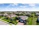 Aerial view of house showing the lush landscaping, tile roof, and the home's location in a residential area at 16612 5Th E Ave, Bradenton, FL 34212