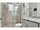 Bathroom featuring glass enclosed shower with tile surround, granite vanity and updated fixtures at 16612 5Th E Ave, Bradenton, FL 34212
